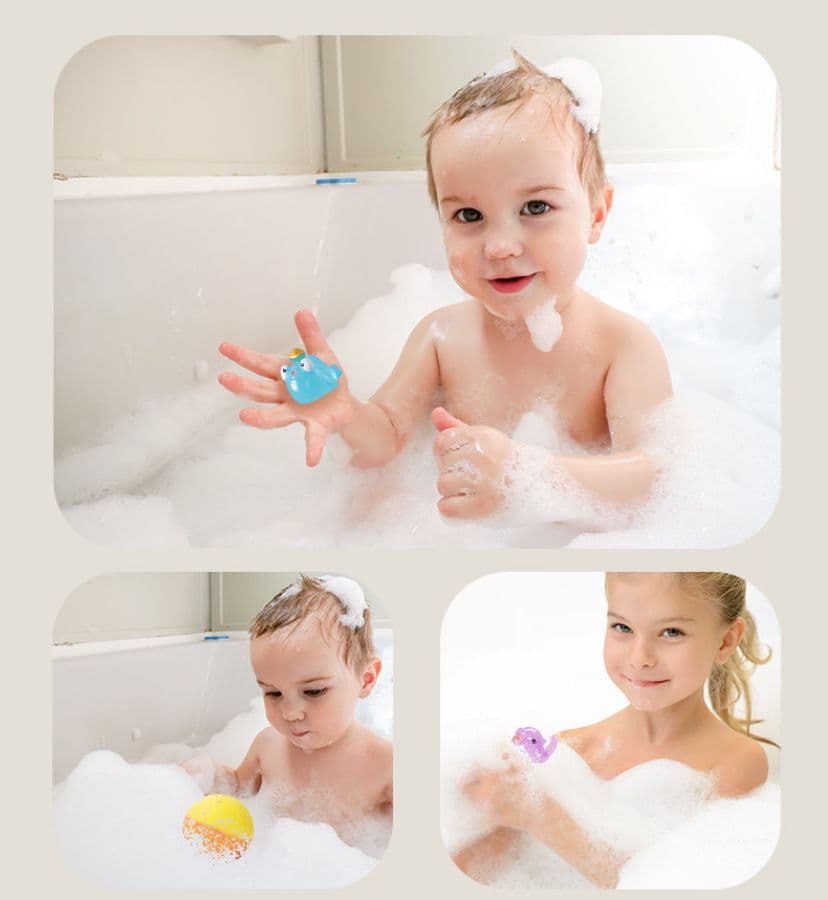 Happy children playing with SplashBombs ocean toys in the bath